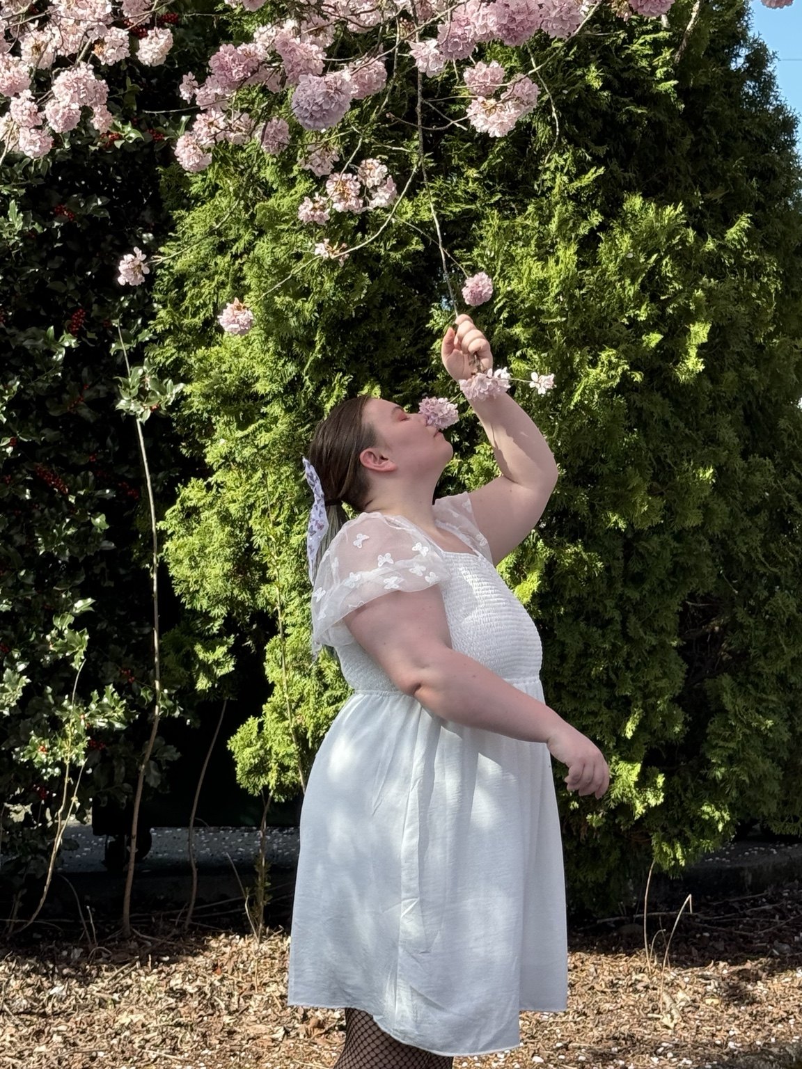 Soft portrait under spring blossoms